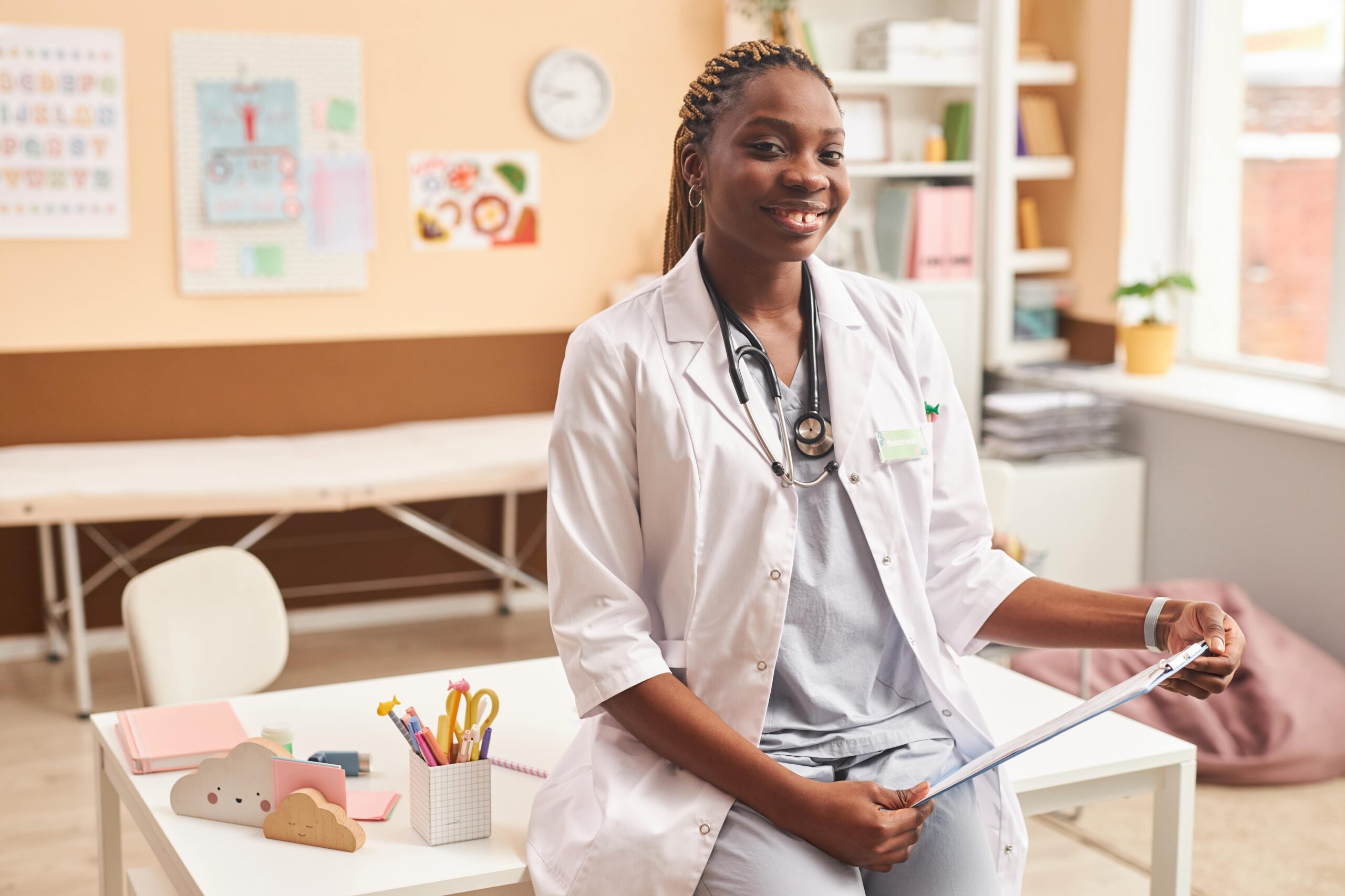 Young Black Doctor as Female Doctor at Camera in Clinic for Children